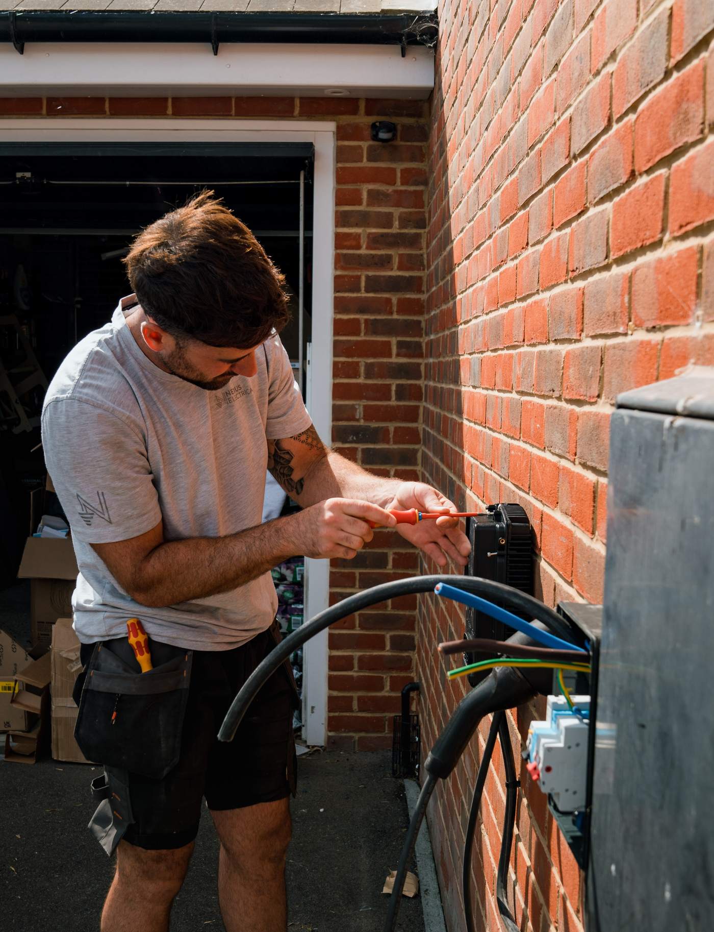 Tom from Nexus Electrical wiring an EV charger